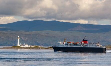 A ferry from Oban passes a lighthouse on Lismore.