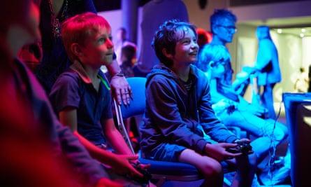 Two boys play video games at Norwich Games Festival, Norwich.
